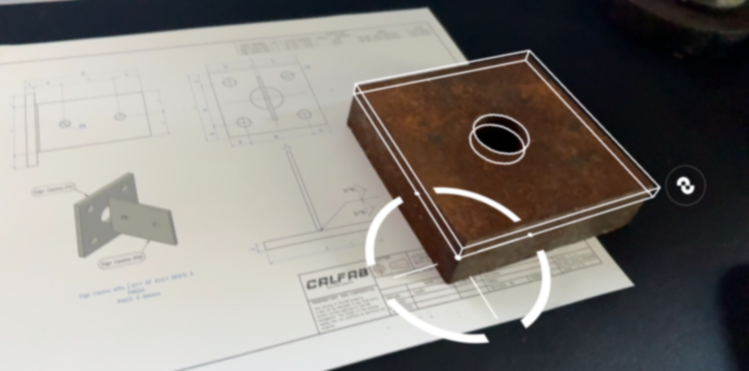 Augmented reality overlay of a CAD model checked against a fabricated steel part in the shop